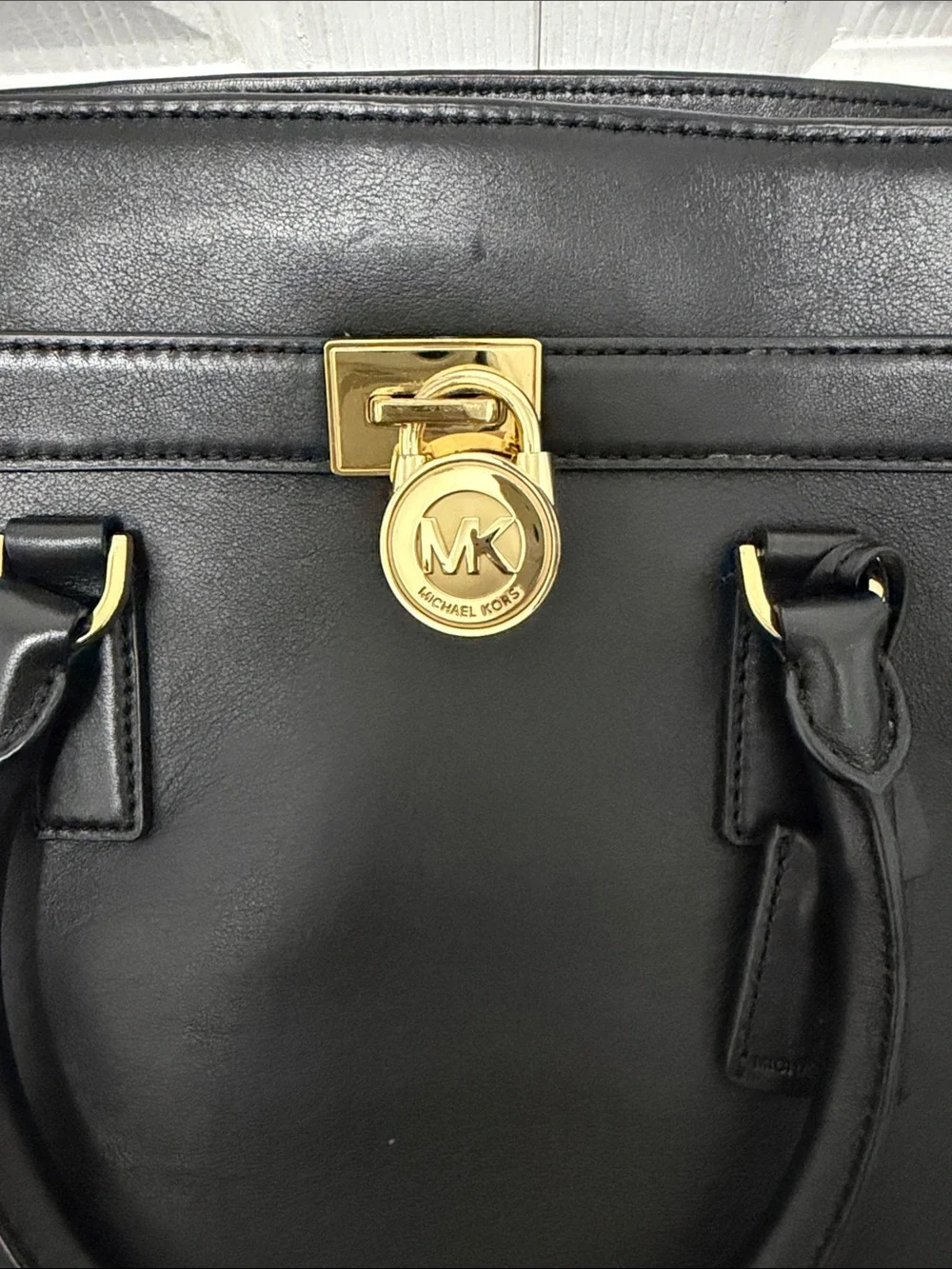 Michael Kors Black Leather Satchel with Gold Accent Charm